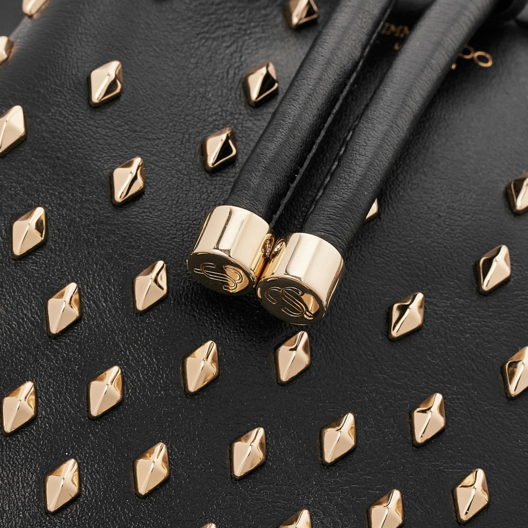 Gold studded top clutch bag