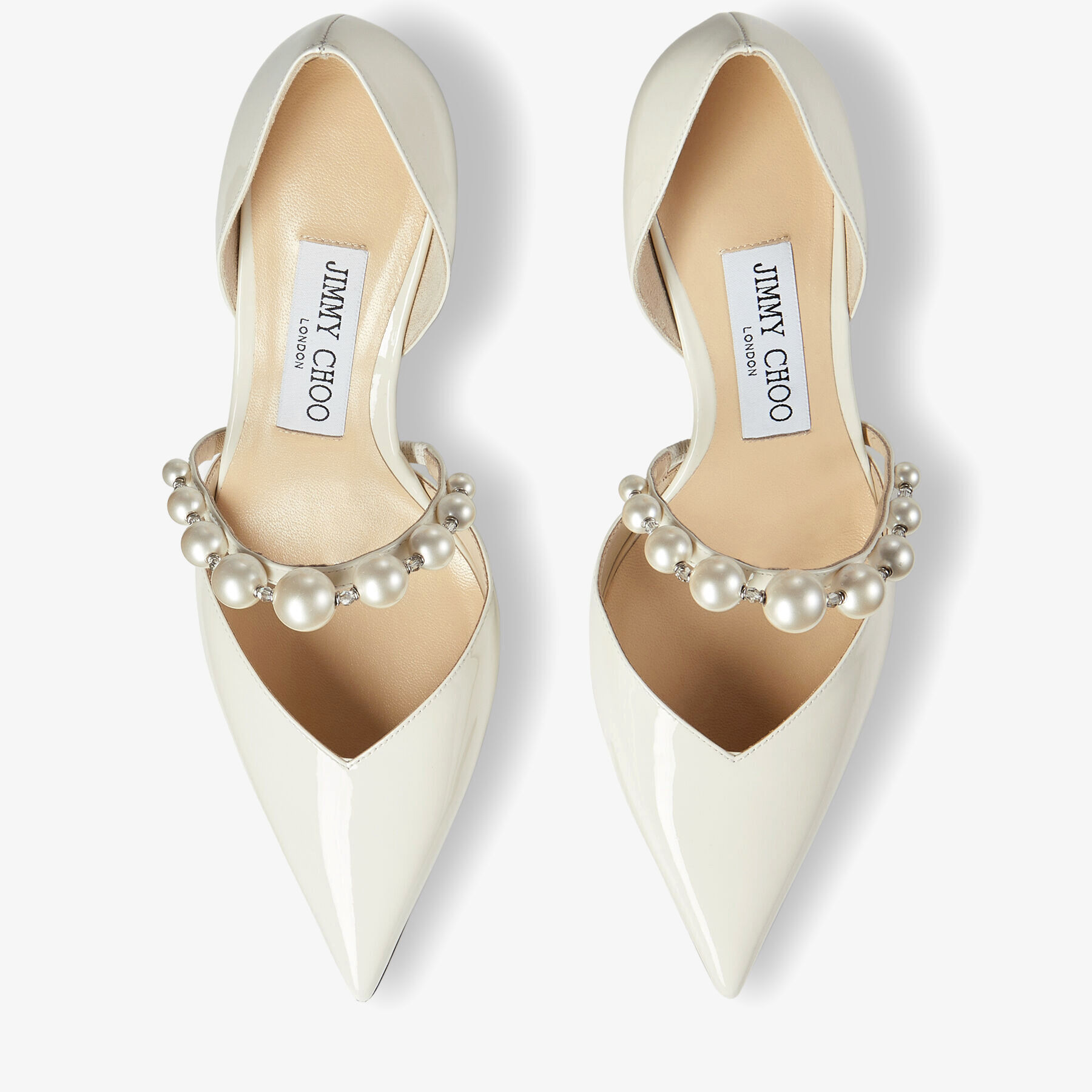 Romy 85 bow-embellished leather pumps in beige - Jimmy Choo | Mytheresa