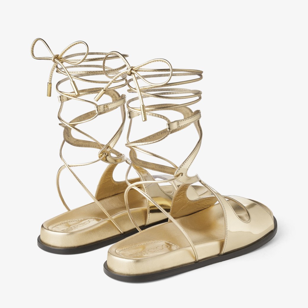 シューズ・サンダルその他 JIMMY CHOO Woman Flat sandals Gold AVENUE FLAT | Gold Metallic Nappa Leather Flat Sandals