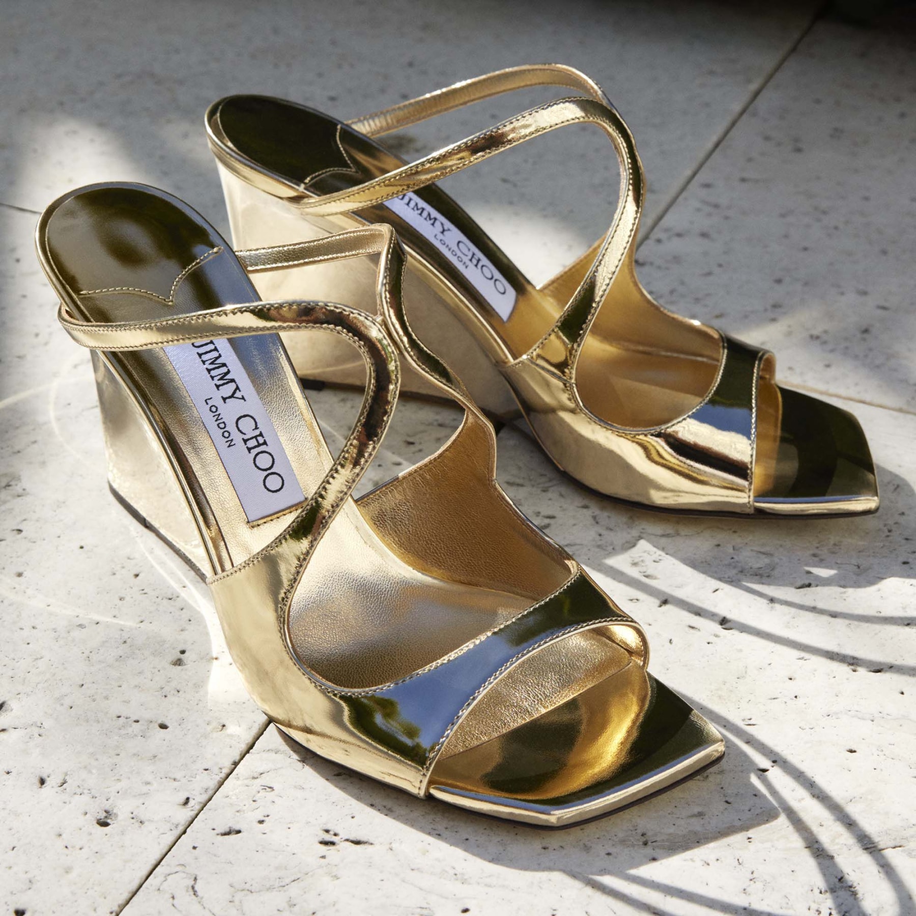 【Jimmy Choo】アジー85 ソフトゴールドタッセルサンダル ANISE WEDGE 85 | Gold Liquid Leather Metal Wedge Mules