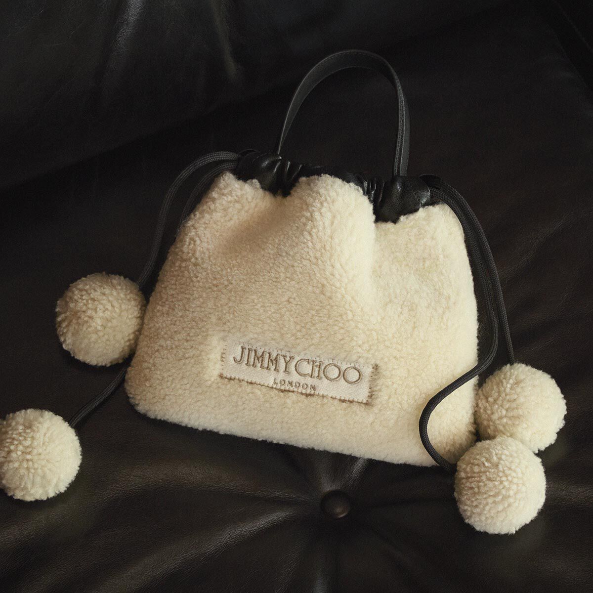 Drawstring Pouch Top Handle | Natural and Black Shearling and