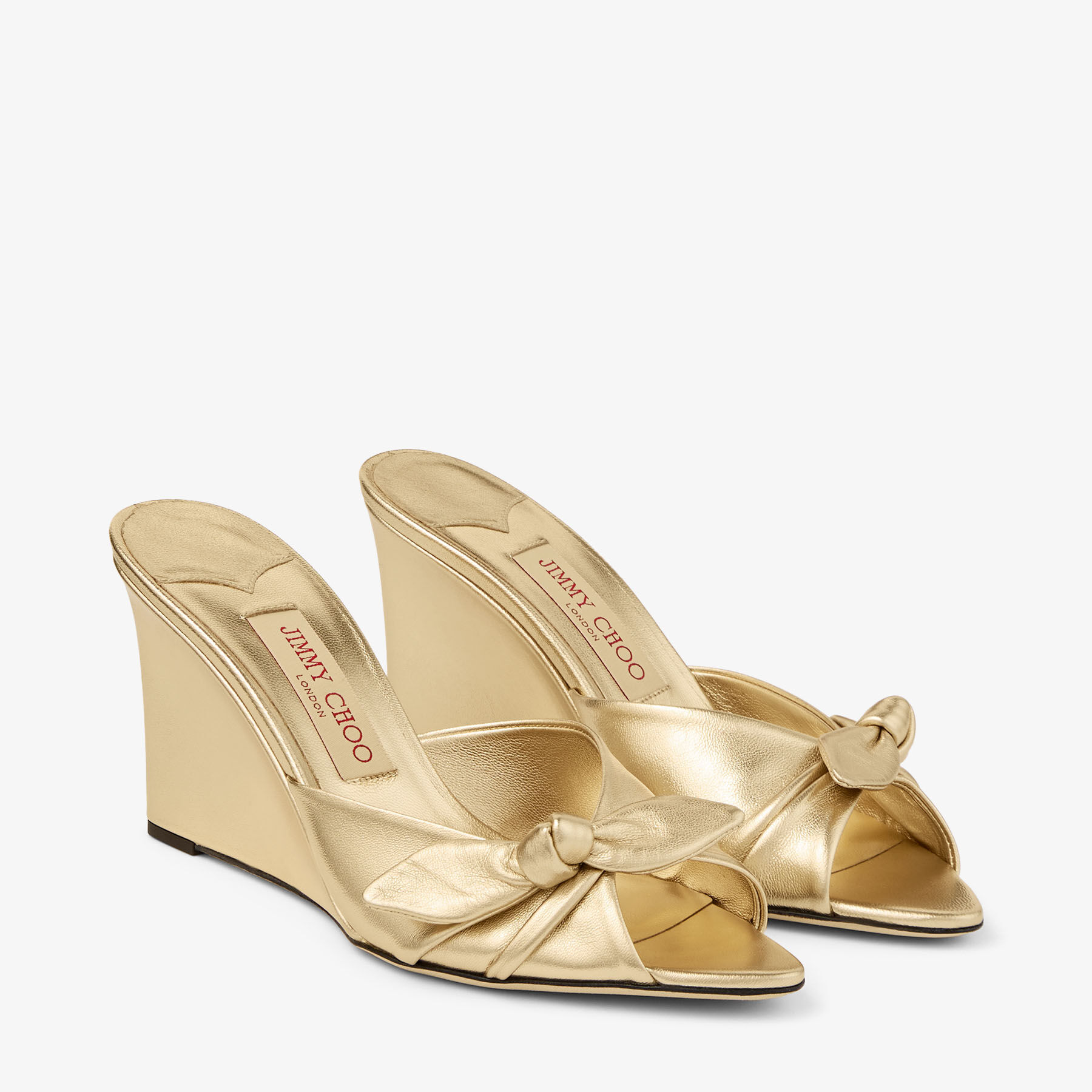 Livi Wedge 85 | Gold Metallic Nappa Leather Mules Wedges with Bow