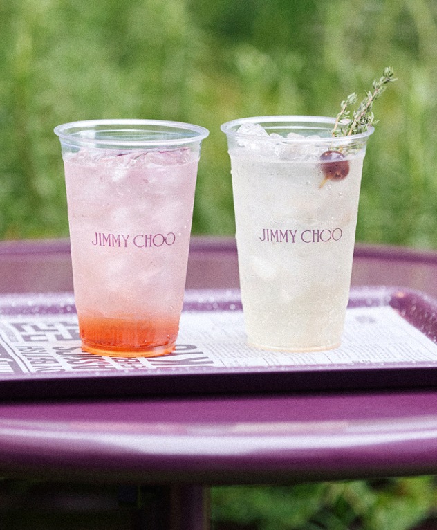 Two iced Jimmy Choo drinks on a purple caf&eacute; table.
