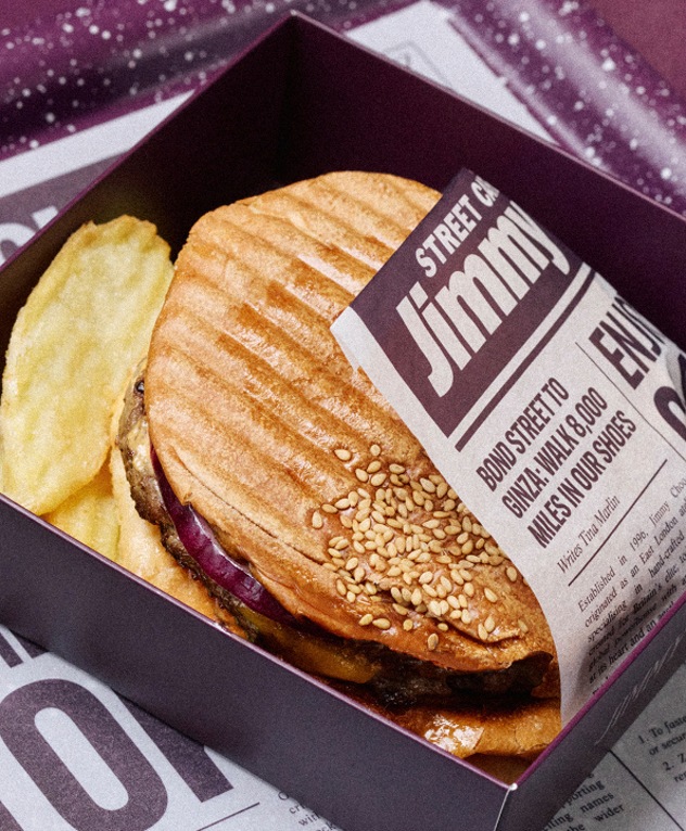 Toasted sandwich served in Jimmy Choo branded packaging.