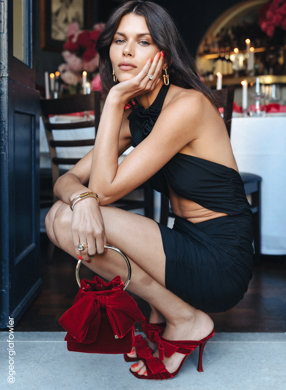 Jimmy Choo models style embellished heeled pumps and hold crystal-embellished mini bags