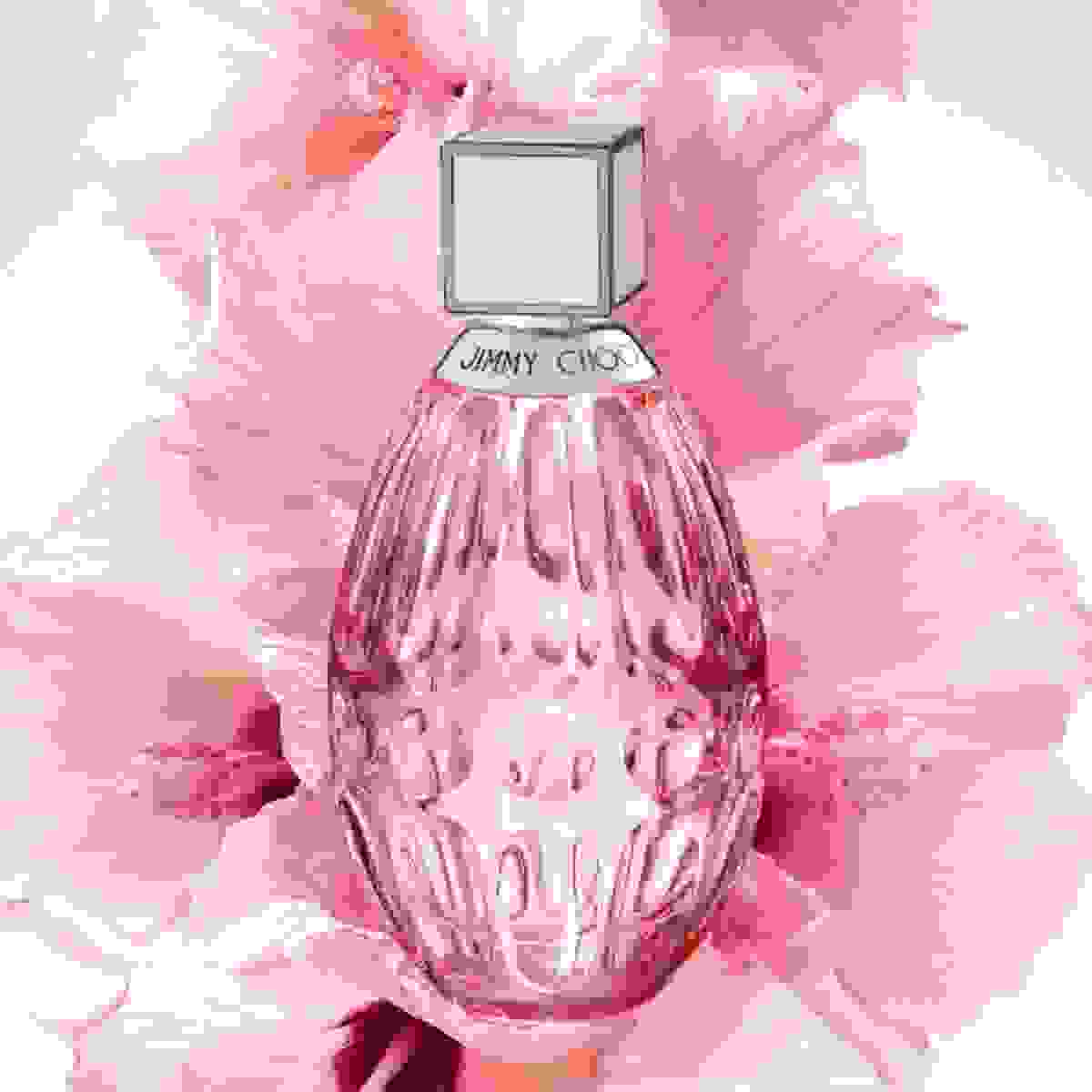 Jimmy Choo women’s fragrance positioned in front of pink flower