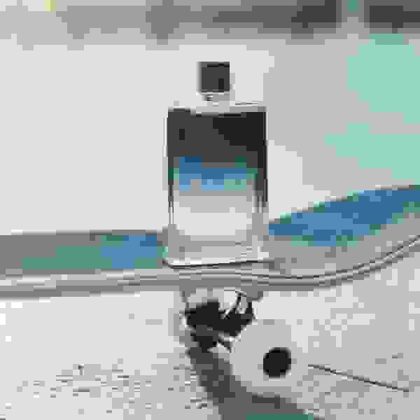 Jimmy Choo men’s blue fragrance on skateboard