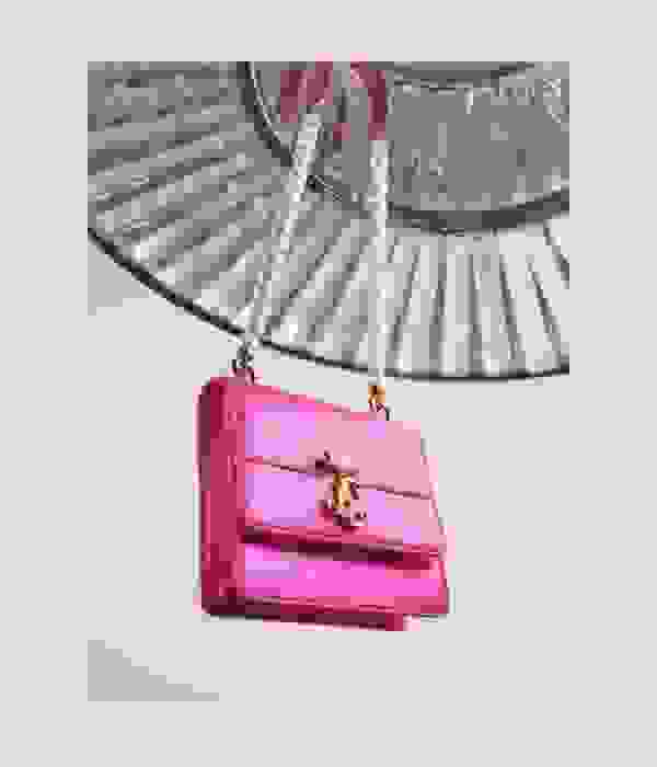Model styling Jimmy Choo pink satin shoes and handbags with pearl details 