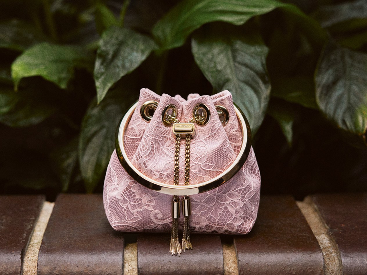  Crystal-embellished strappy heeled sandal with delicate ankle strap, styled beneath sheer tulle.