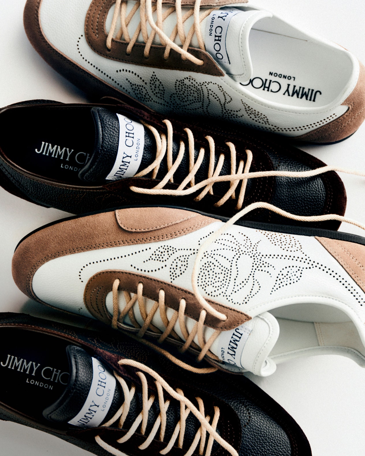 Close-up of collection of sneakers. Photographed against a white background..