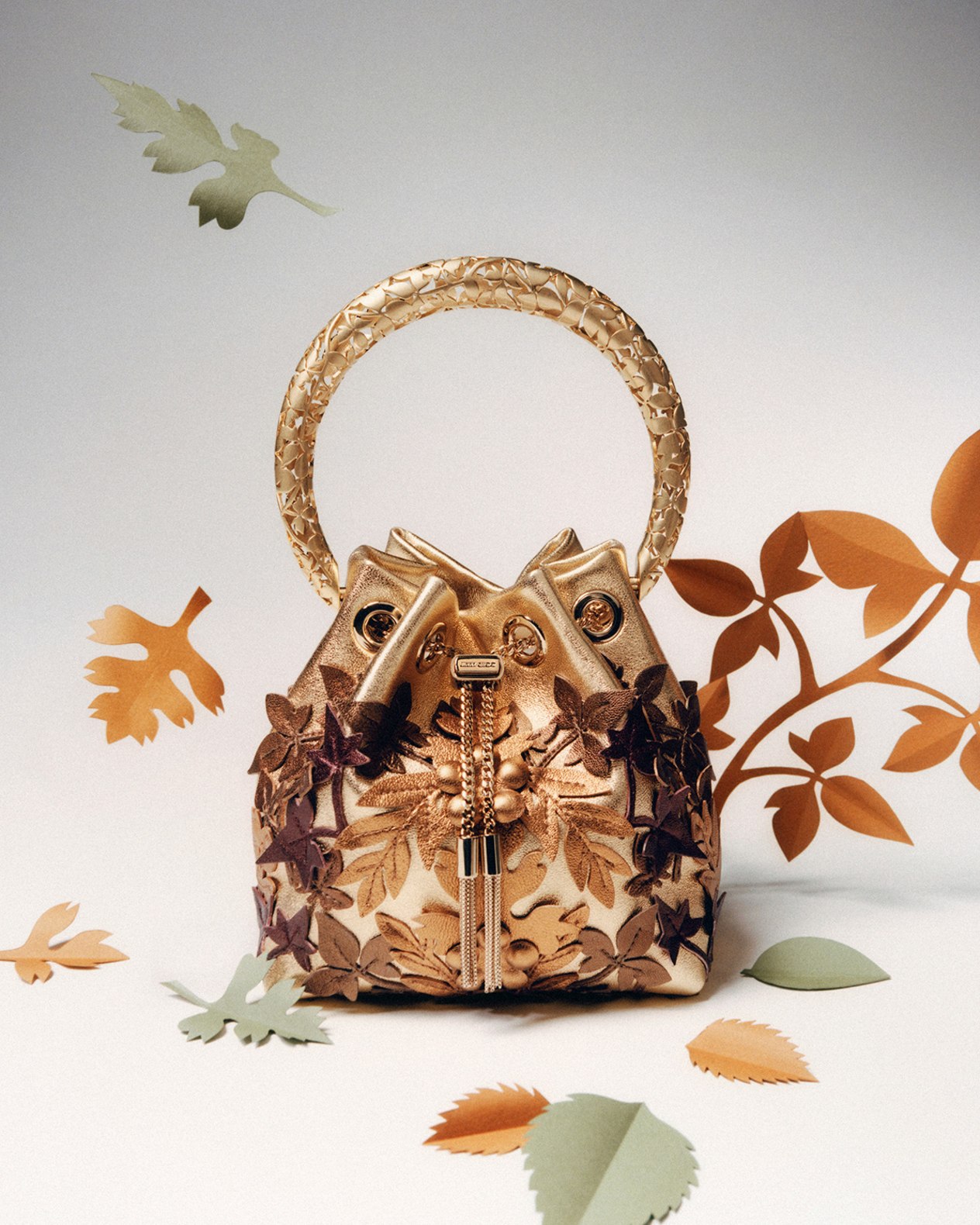 Model holding a white top-handle bridal bag, photographed in black and white.