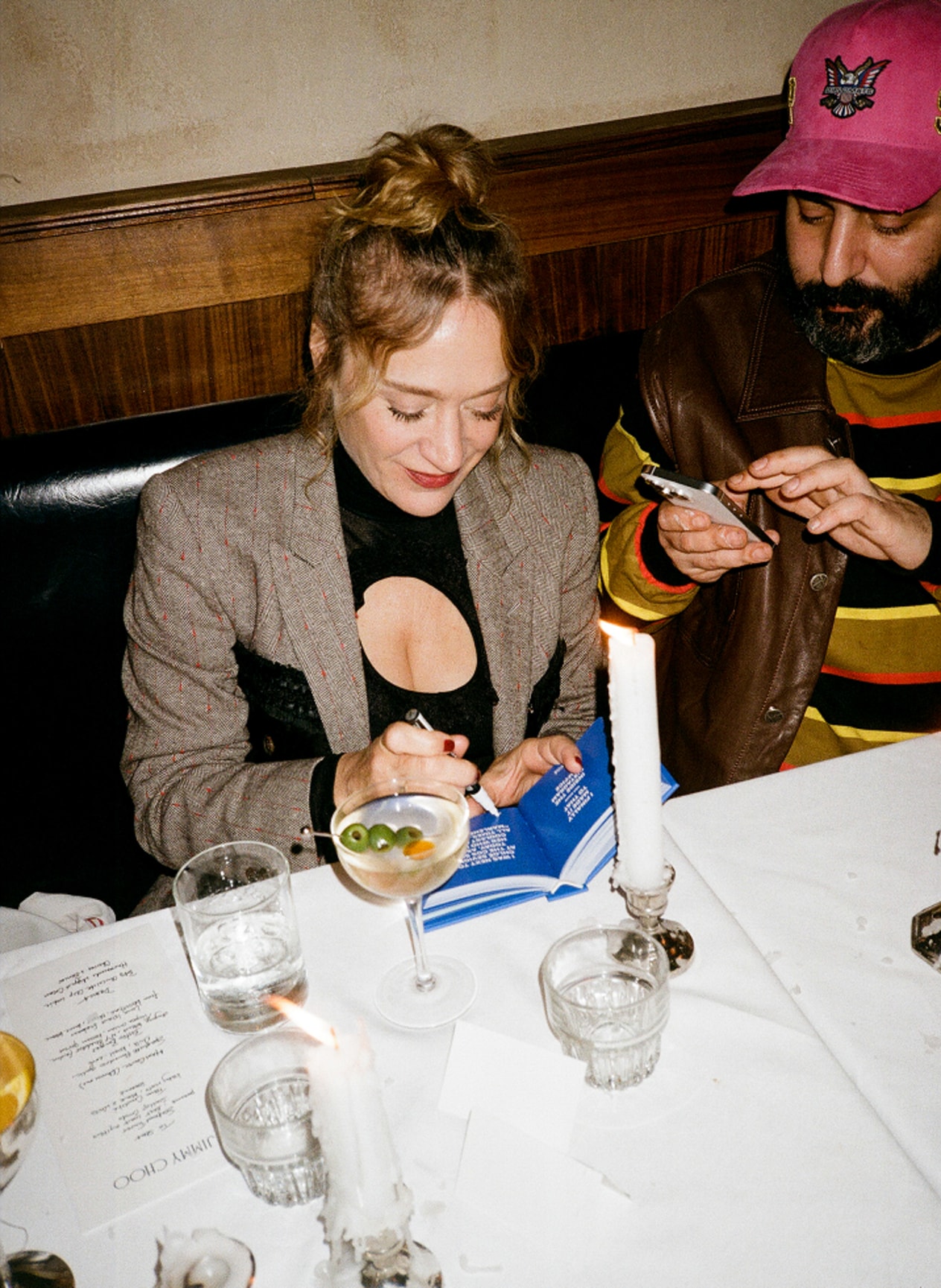 Chloë Sevigny signing on a book