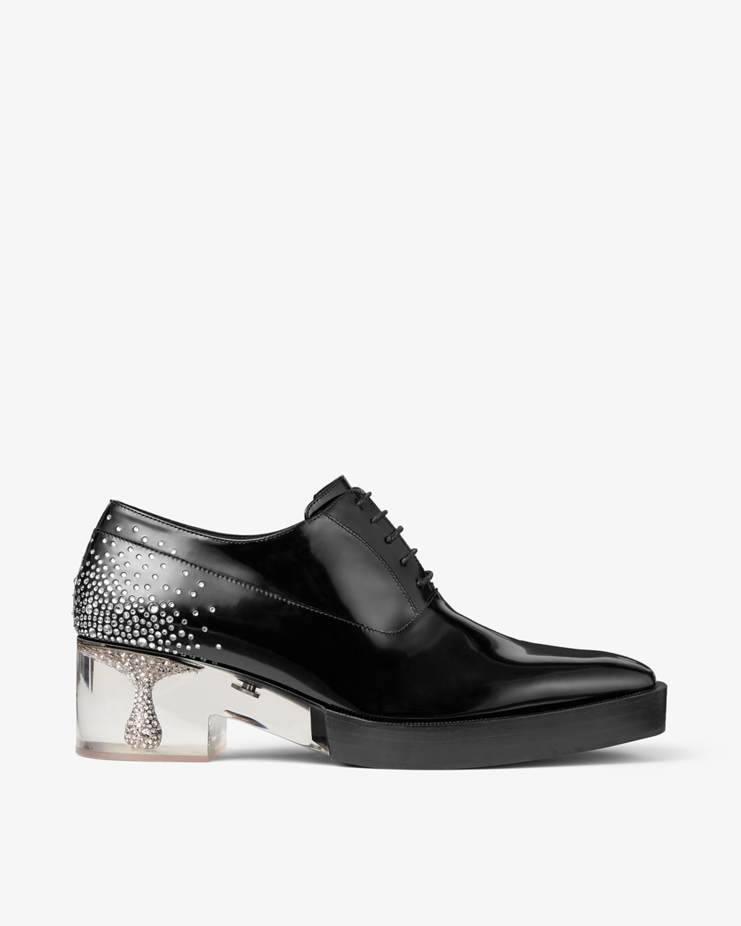 Black leather lace-up shoes with crystal-embellished and plexi heel, worn with sheer socks.