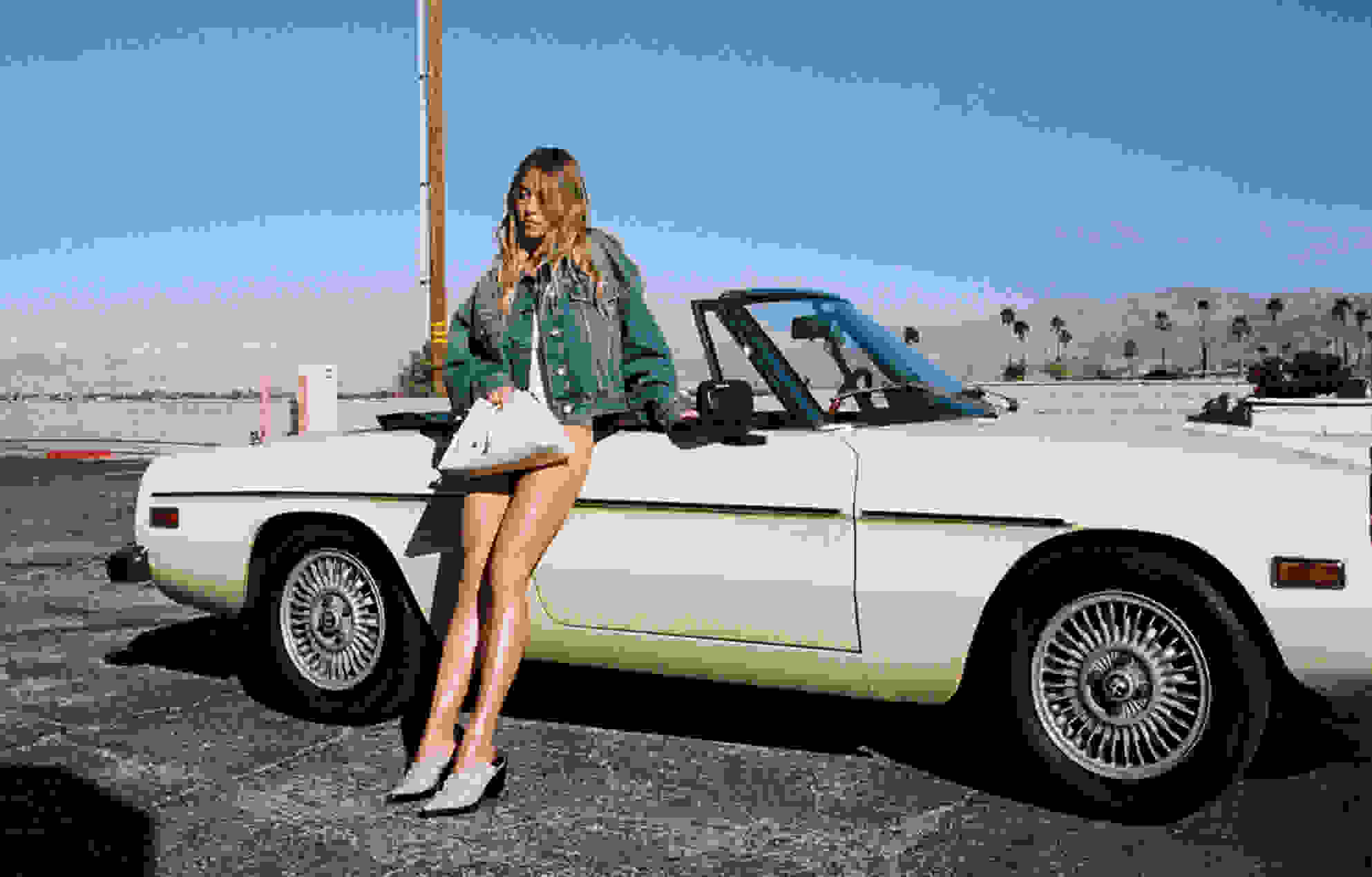 Sydney Sweeney wears the Cinch handbag in Jimmy Choo's Summer 2024 campaign