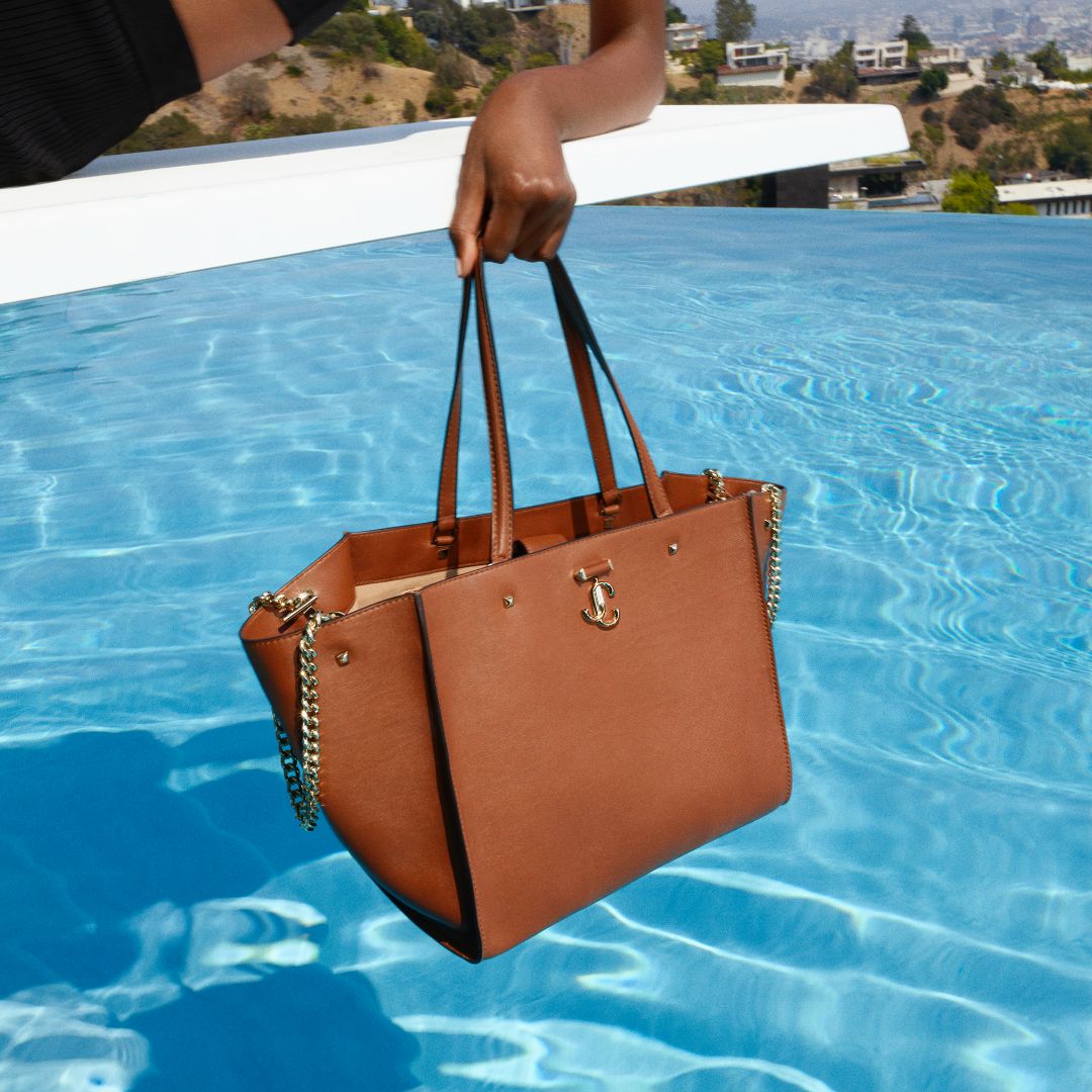 Jimmy Choo women’s clutch bag with tortoiseshell chain strap