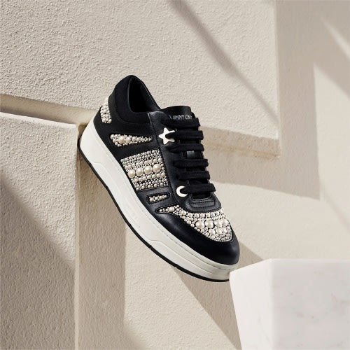 Jimmy Choo female model wearing Jimmy Choo Star Fringe Earrings with Swarovski crystals