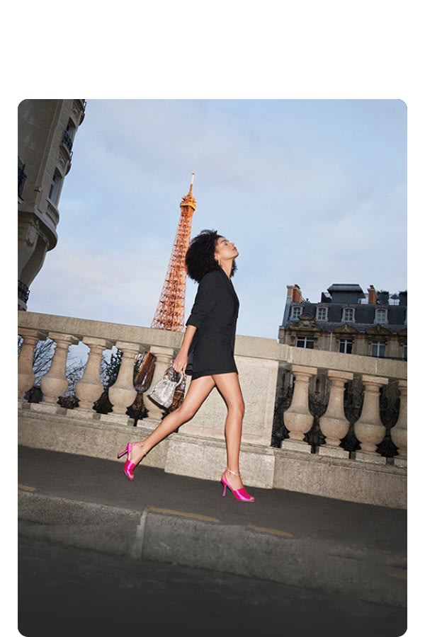 Jimmy Choo model wearing women's pink sandals